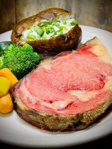 Prime Rib with a Baked Potato covered with Sour Cream and Chives